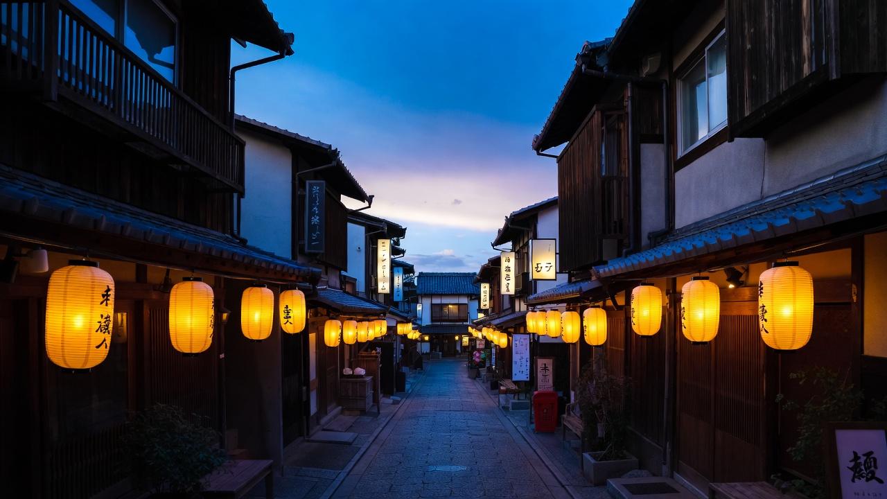 Geisha quarter lantern-lit streets at dusk in Gion district